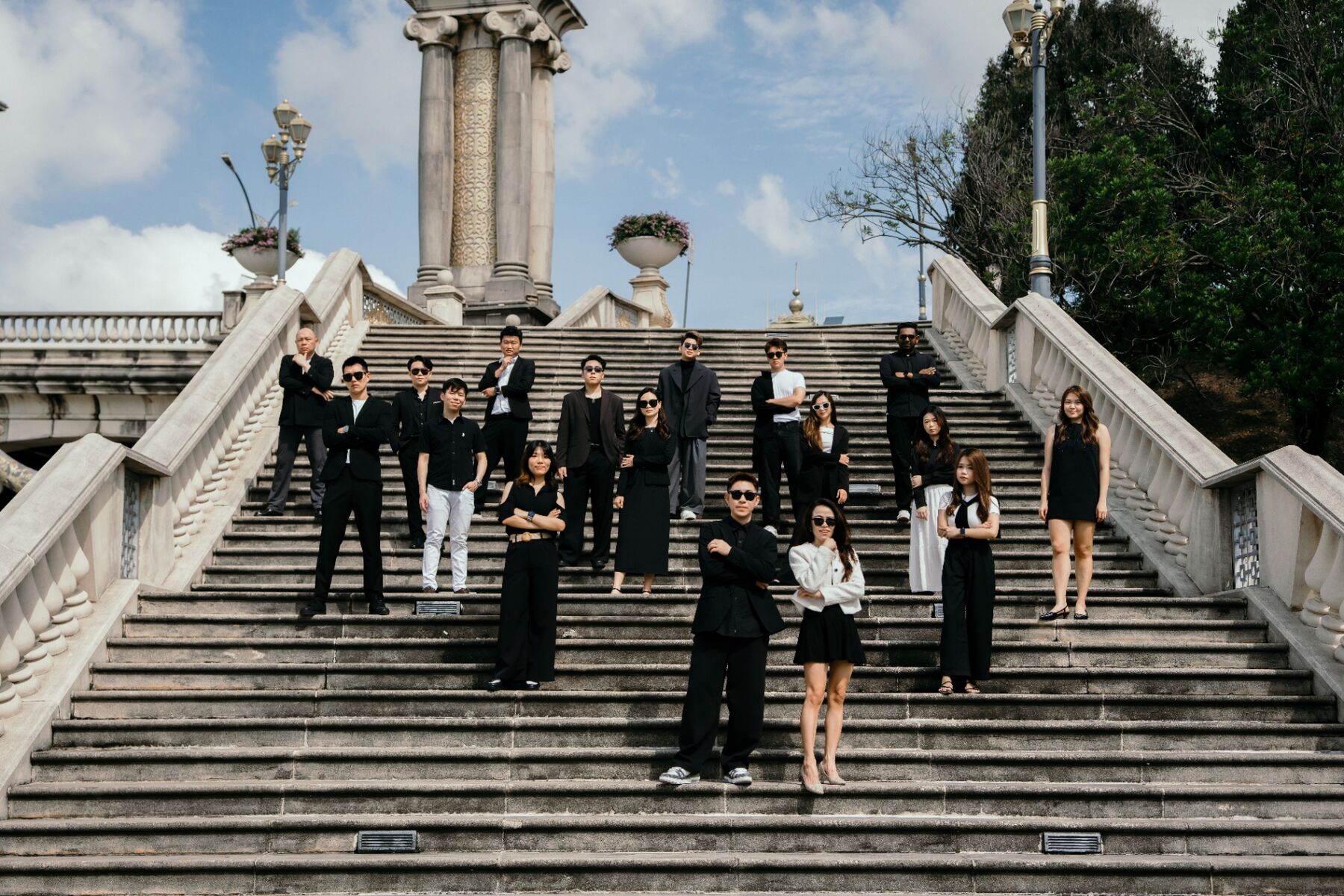 Kevin Lee team — group portrait on the steps